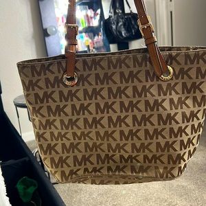 This is a Michael Kors Tote in MK monogram cloth.